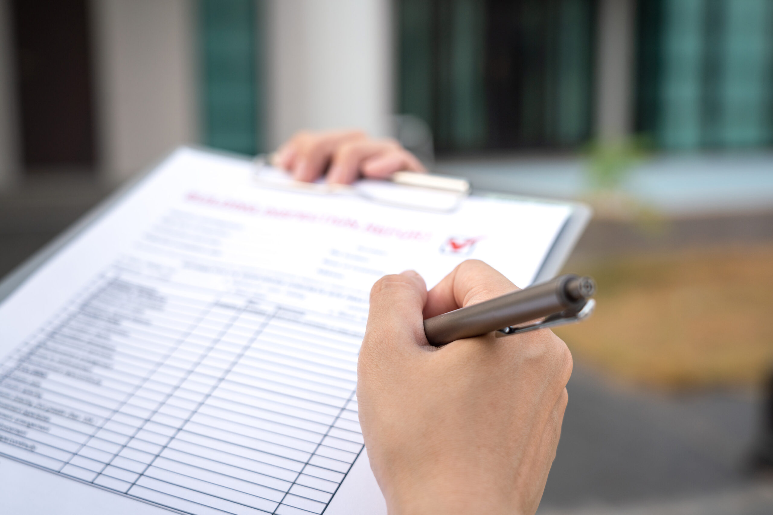 Person filling out a property pre-settlement inspection checklist during a pre-settlement home inspection in Perth.